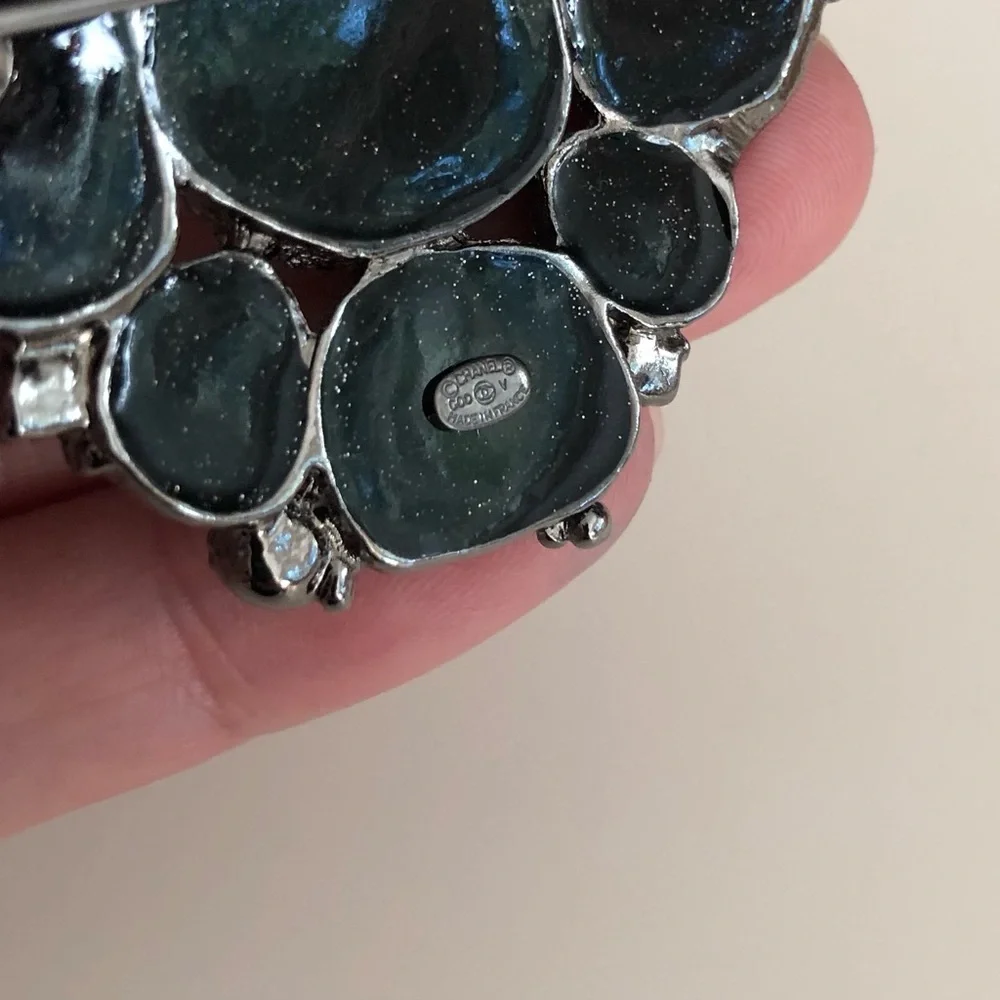 CHANEL Black Camellia Brooch - Signature Logo Accent